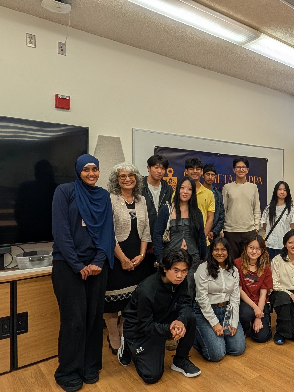 Myriam S. Moody with students at an honor society induction event