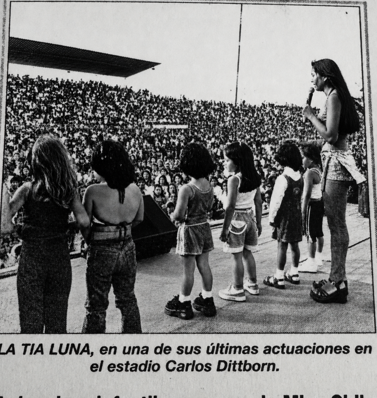 Vintage newspaper photo of Daniela hosting her live children's show Tía Luna on stage